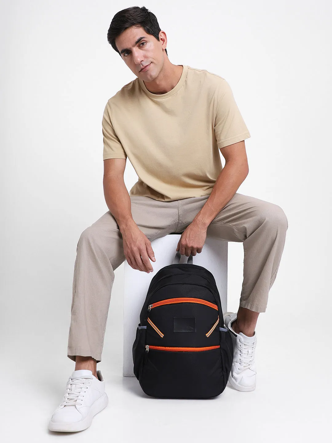 Men's Black & Orange Water Repellent Travel Backpack with adjustable shoulder strap